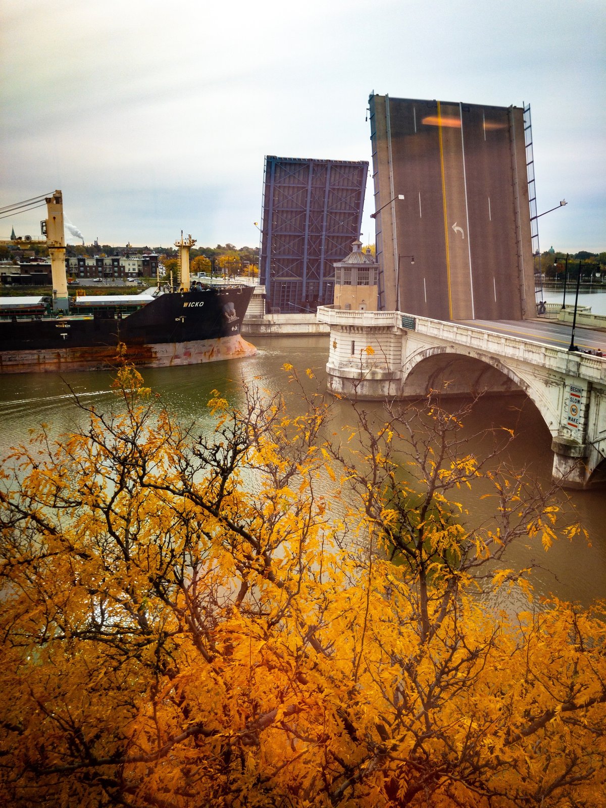 The ship Wicko approaches the opened Cherry Street Bridge in downtown Toledo, OH.